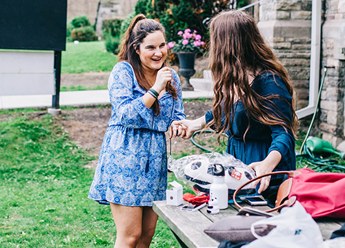 Two high school students sharing a laugh