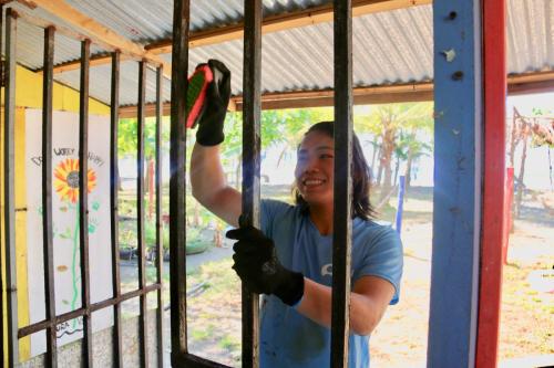 Student participating in building activity