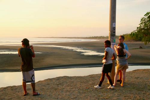 Group of students on beach before sunset