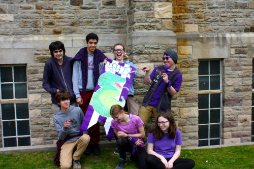 Group of students with House Basilisk sign